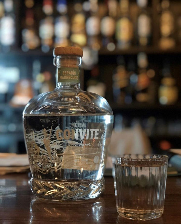 Bottle of Espadin Madrecuixe on a bar.